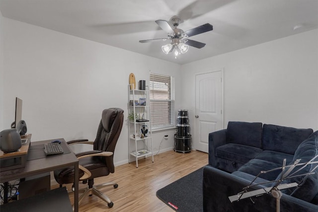 office with ceiling fan and light wood-type flooring