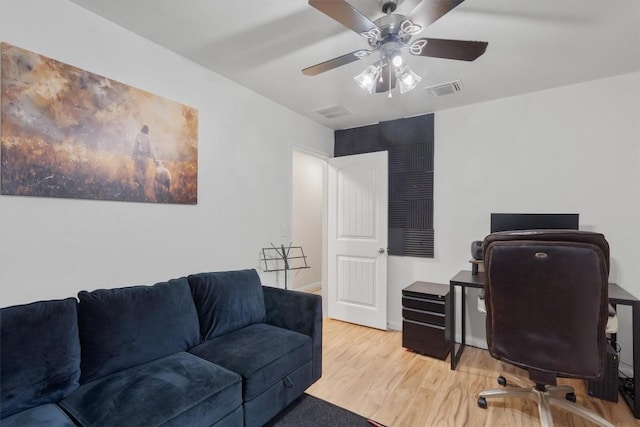 office space featuring ceiling fan and light hardwood / wood-style flooring