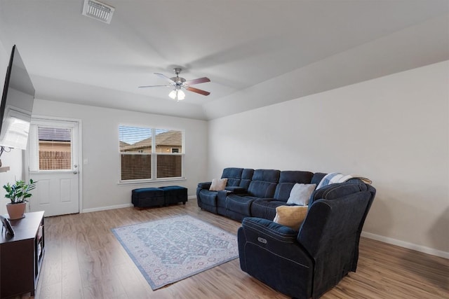 living room featuring ceiling fan and light wood-type flooring