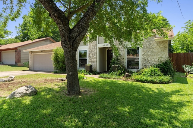 8406 Seminary Ridge Dr, Austin, TX 78745 - view of front of property with a garage, stone siding, and driveway