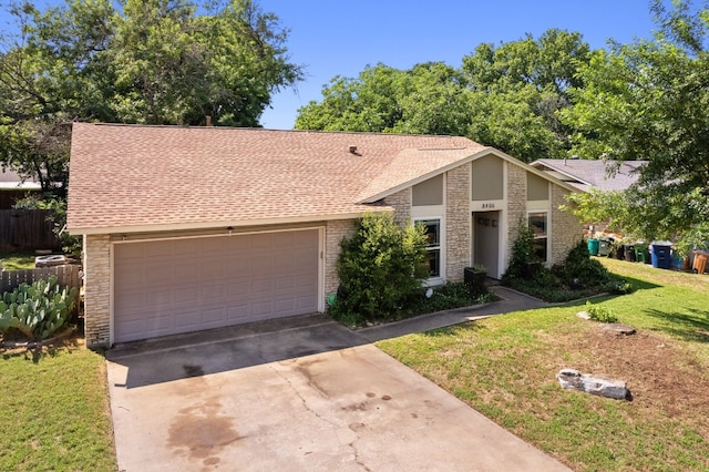 8406 Seminary Ridge Dr, Austin, TX 78745 - mid-century home with stone siding, driveway, an attached garage, and a shingled roof