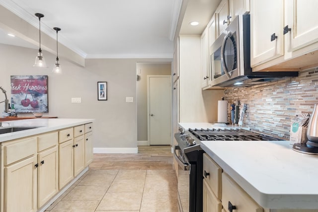 kitchen featuring sink, appliances with stainless steel finishes, hanging light fixtures, tasteful backsplash, and ornamental molding