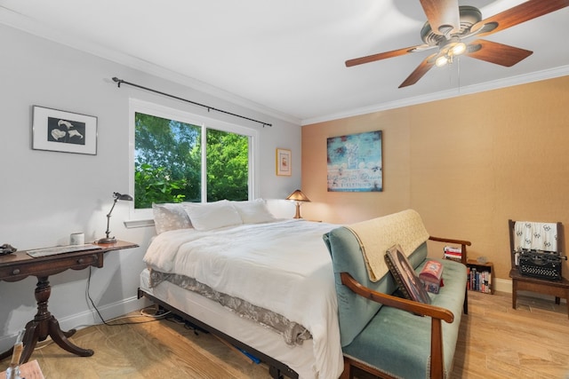 bedroom featuring ceiling fan, ornamental molding, and light hardwood / wood-style floors