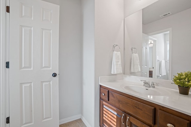 bathroom with vanity and tile patterned flooring