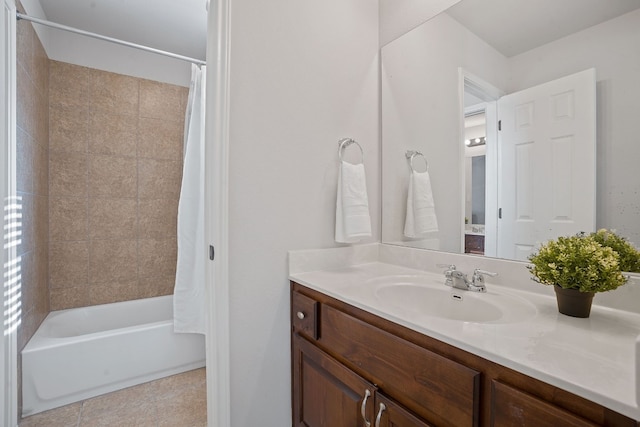 bathroom featuring vanity, tile patterned flooring, and shower / bath combo with shower curtain