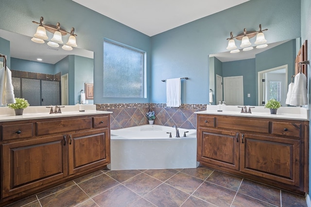 bathroom with independent shower and bath and vanity