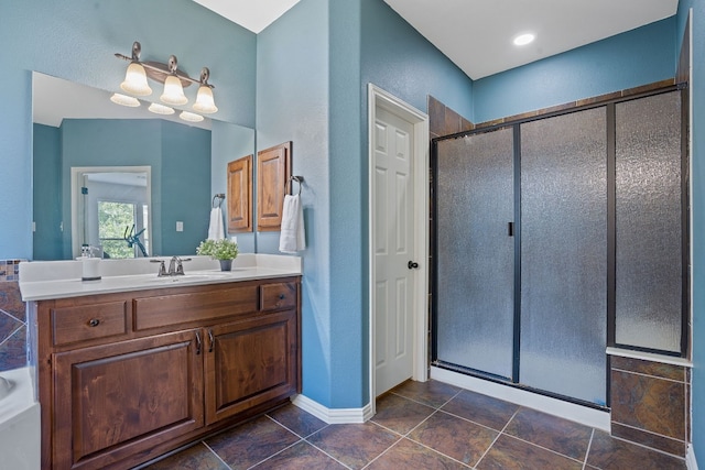 bathroom featuring a notable chandelier, vanity, an enclosed shower, and tile patterned floors