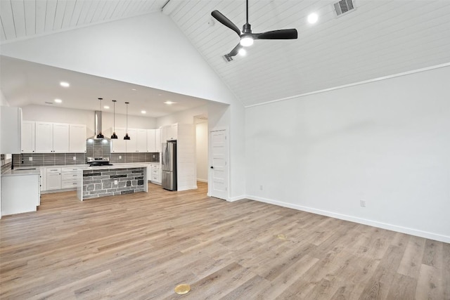 living room featuring visible vents, baseboards, high vaulted ceiling, ceiling fan, and light wood-style floors