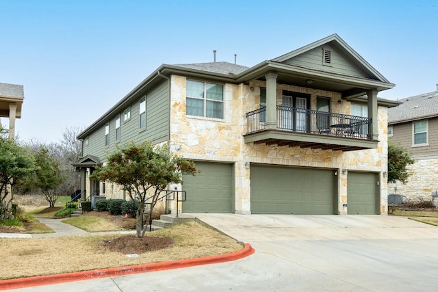 view of front of house featuring a balcony and a garage