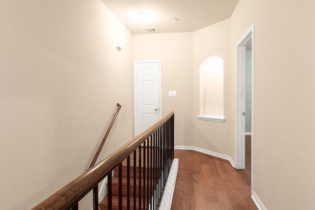 hall with wood-type flooring