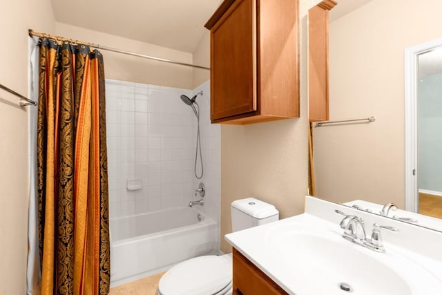 full bathroom featuring shower / bath combo, vanity, and toilet