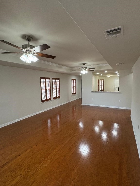 unfurnished living room with dark wood-type flooring and ceiling fan