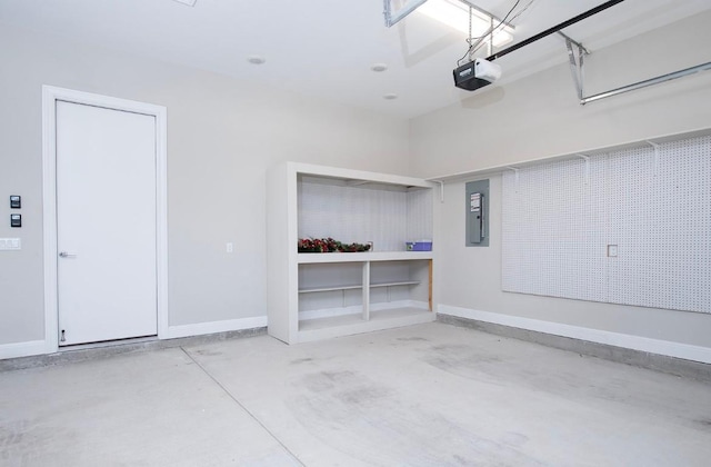 garage with a garage door opener and electric panel