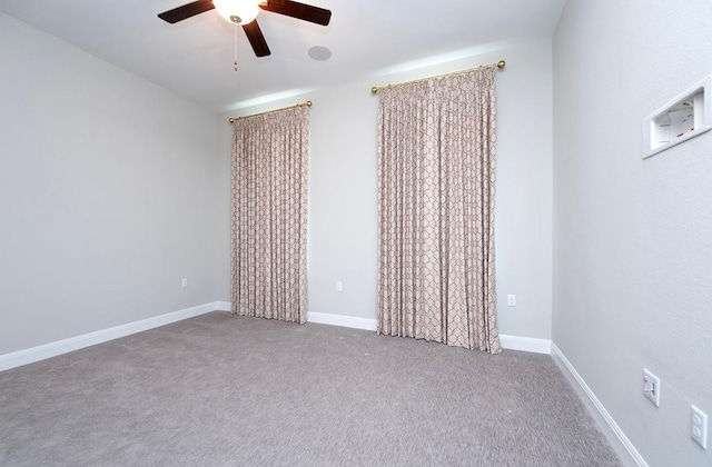 unfurnished room with carpet flooring and ceiling fan