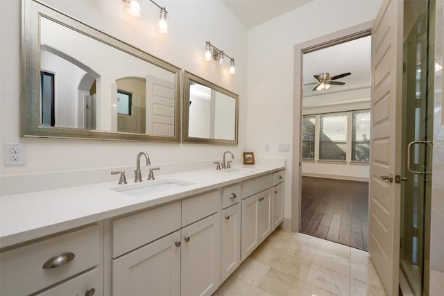 bathroom featuring ceiling fan and vanity