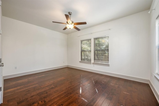 unfurnished room featuring ceiling fan and dark hardwood / wood-style flooring