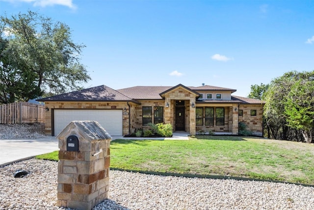 view of front facade featuring a garage and a front yard