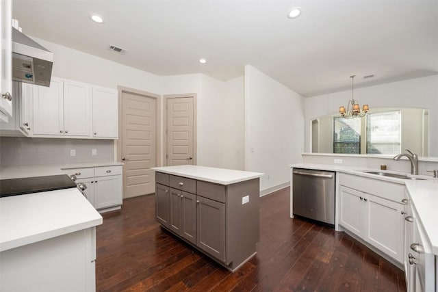 kitchen with a kitchen island, sink, white cabinets, stainless steel dishwasher, and wall chimney exhaust hood