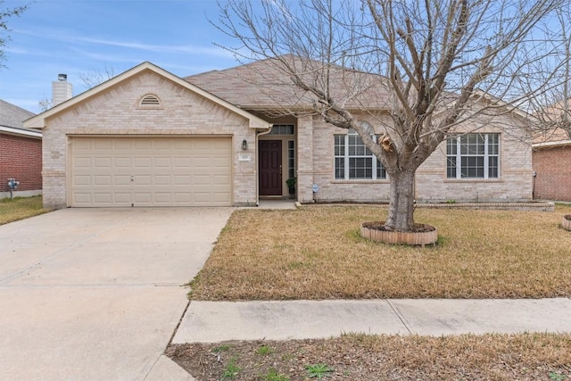 ranch-style home with a garage and a front yard