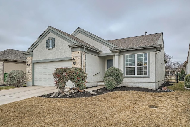 view of front of home with a garage and a front yard