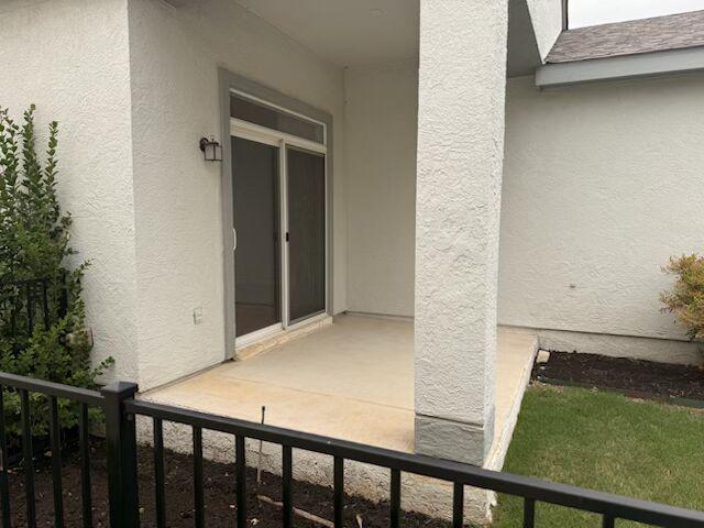 254 Monument Hill Trl, Georgetown, TX 78633 - entrance to property with stucco siding and a balcony
