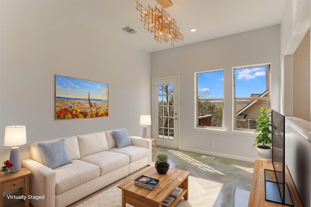 living room featuring an inviting chandelier