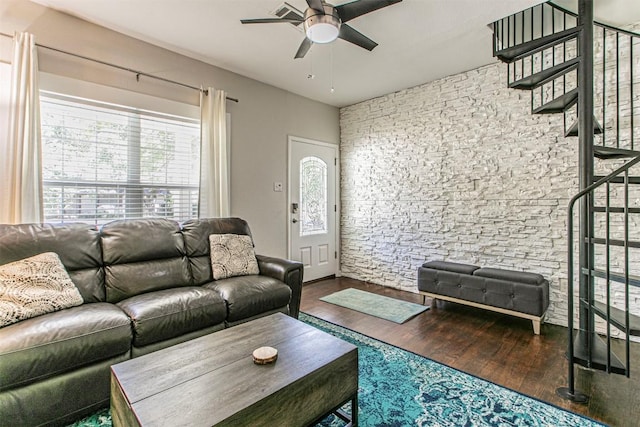 living room featuring hardwood / wood-style flooring and ceiling fan