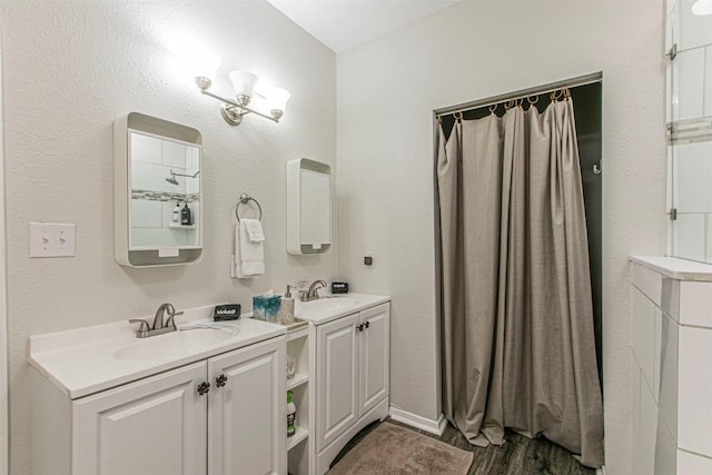 bathroom featuring vanity and wood-type flooring