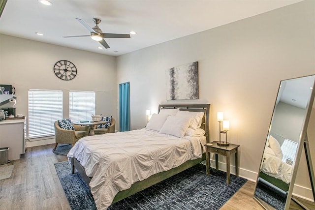 bedroom featuring hardwood / wood-style floors and ceiling fan