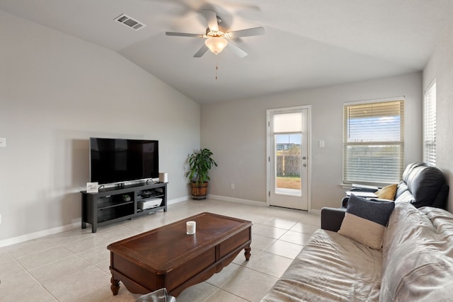 tiled living room with lofted ceiling and ceiling fan