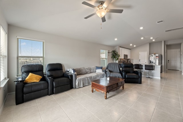 12303 Caldera Way, Manor, TX 78653 - living room with light tile patterned flooring, lofted ceiling, ceiling fan, and recessed lighting