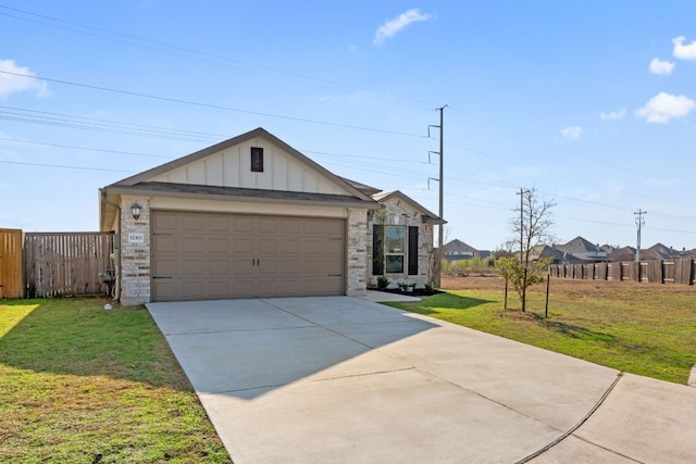 view of front of property with a garage and a front lawn