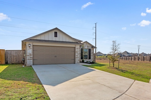 12303 Caldera Way, Manor, TX 78653 - ranch-style house with board and batten siding, concrete driveway, and brick siding