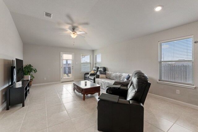 tiled living room with ceiling fan