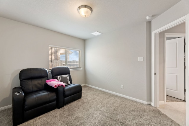 living area featuring light carpet