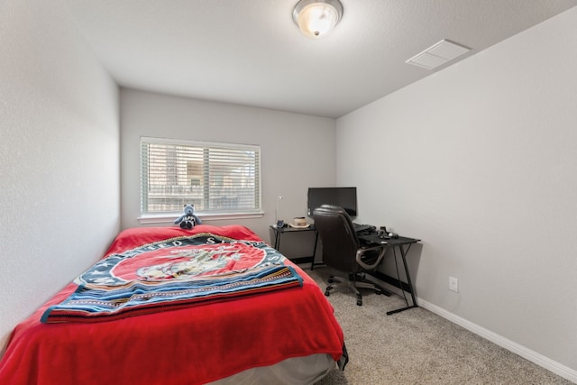 bedroom with light colored carpet