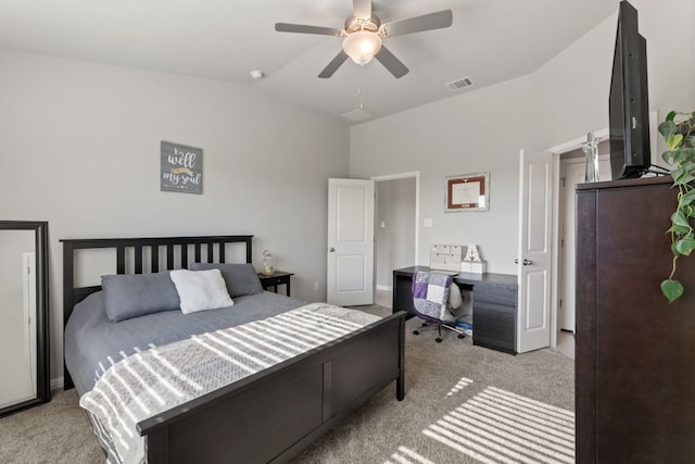 carpeted bedroom with vaulted ceiling and ceiling fan