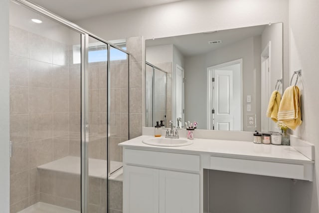 bathroom featuring vanity and walk in shower