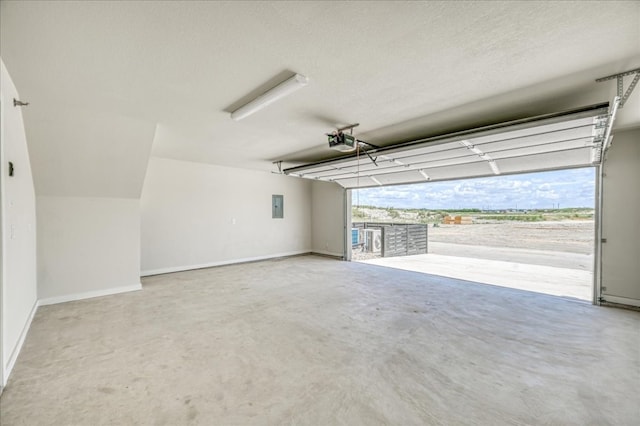 garage featuring a garage door opener and electric panel