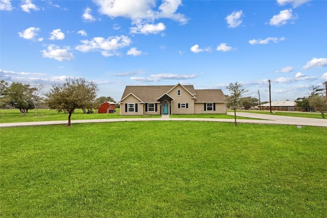 ranch-style home with a front lawn