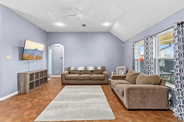 living room featuring vaulted ceiling and ceiling fan