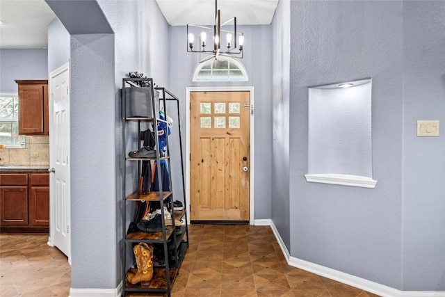 foyer with an inviting chandelier