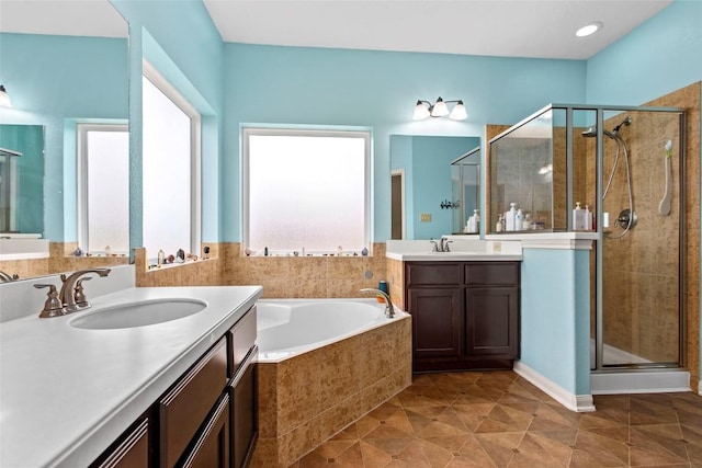 bathroom with independent shower and bath, vanity, and tile patterned flooring