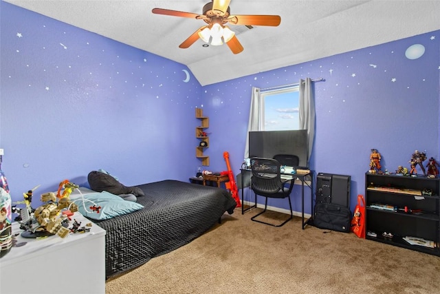 bedroom with lofted ceiling, a textured ceiling, ceiling fan, and carpet