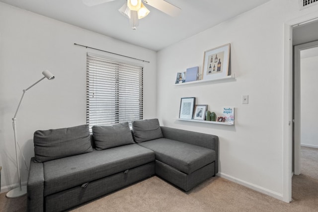 living room featuring ceiling fan and light colored carpet