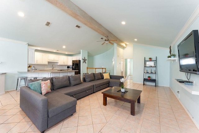 tiled living room with crown molding, ceiling fan, sink, and vaulted ceiling with beams