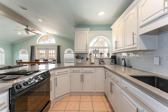 kitchen featuring white cabinetry, black electric range oven, and lofted ceiling with beams