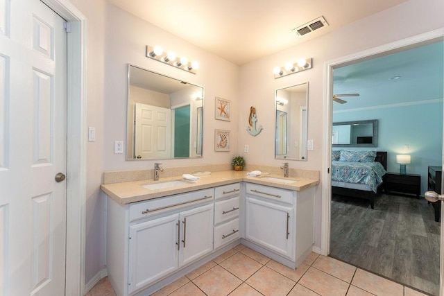 bathroom featuring tile patterned flooring, vanity, and ceiling fan