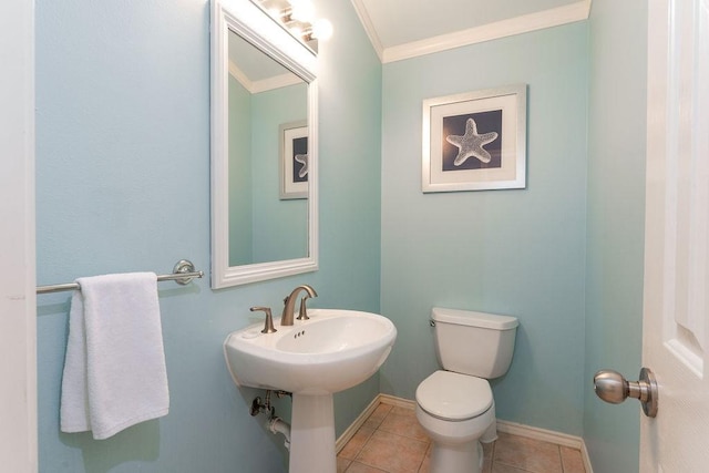 bathroom with ornamental molding, tile patterned floors, and toilet