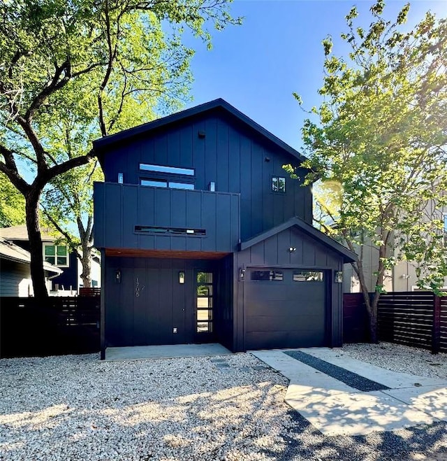 1708 Canterbury St Unit 2, Austin, TX 78702 - modern home with board and batten siding, a garage, a balcony, and driveway